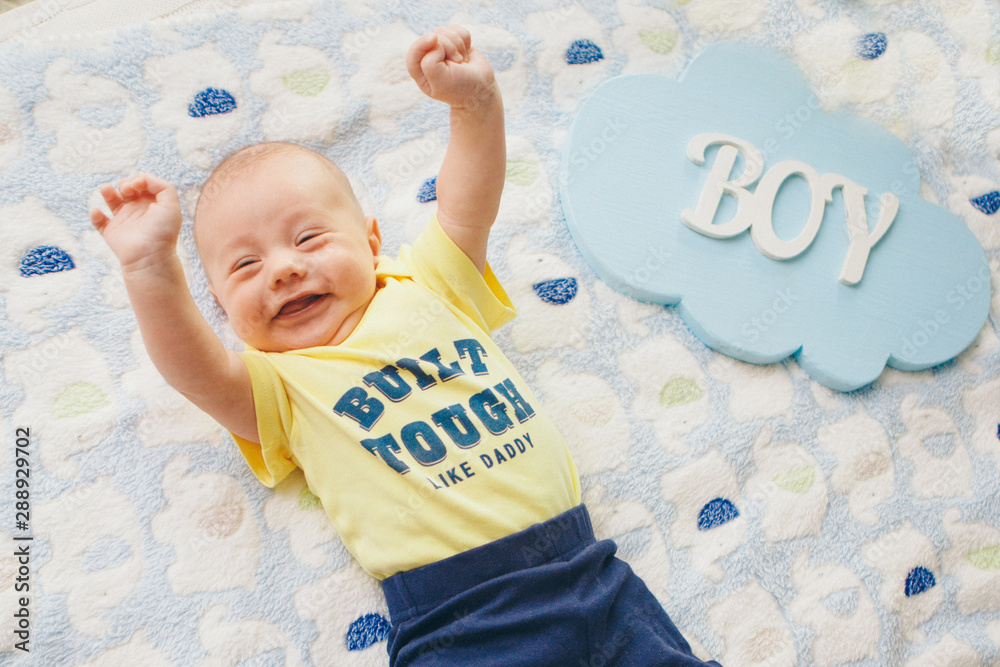 Naklejka premium a child who screams with delight. The little boy raised his hands. the concept of freedom of expression of feelings, emotions, IVF, happiness