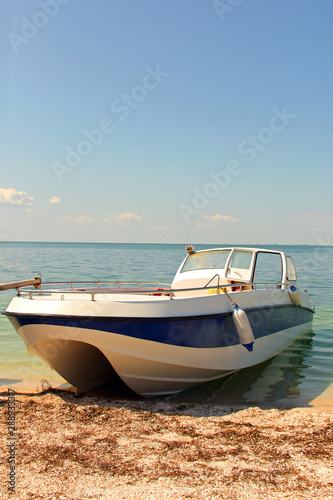 Boat on the seashore. Holidays at sea