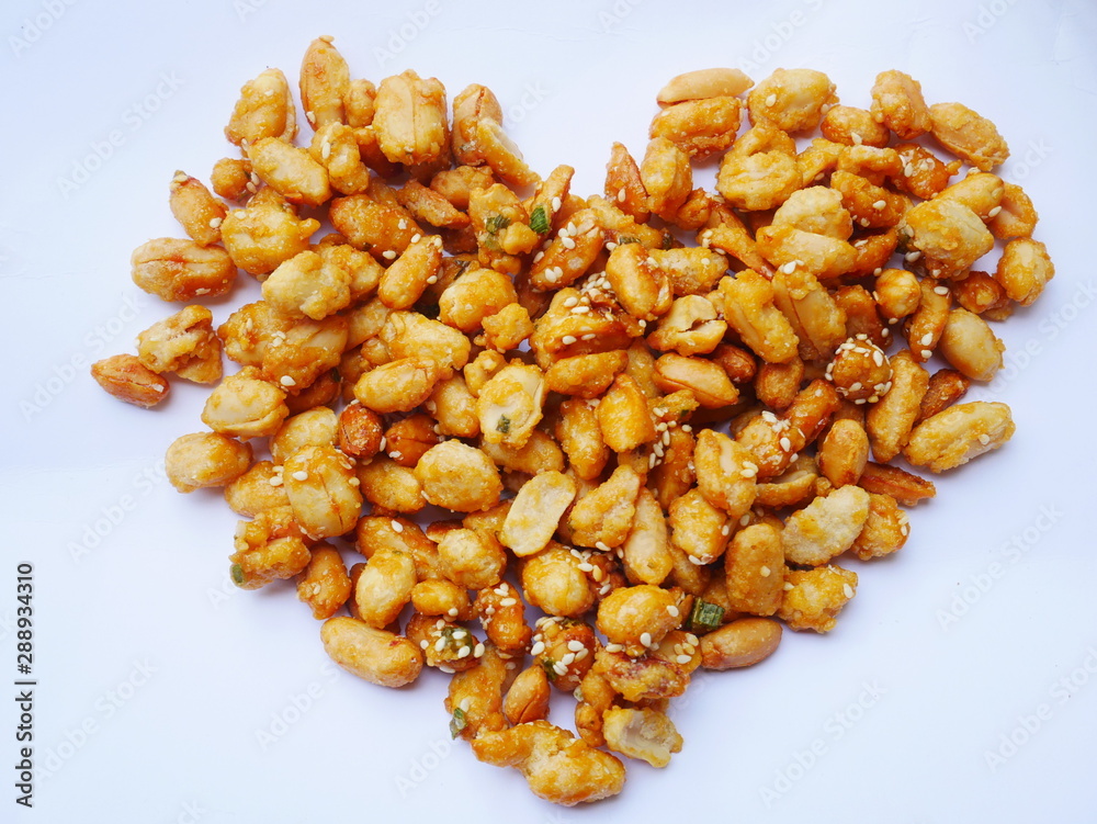Peanuts in caramel isolated on white background