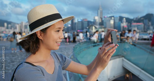 Photography Travel woman take photo of the city in Hong Kong