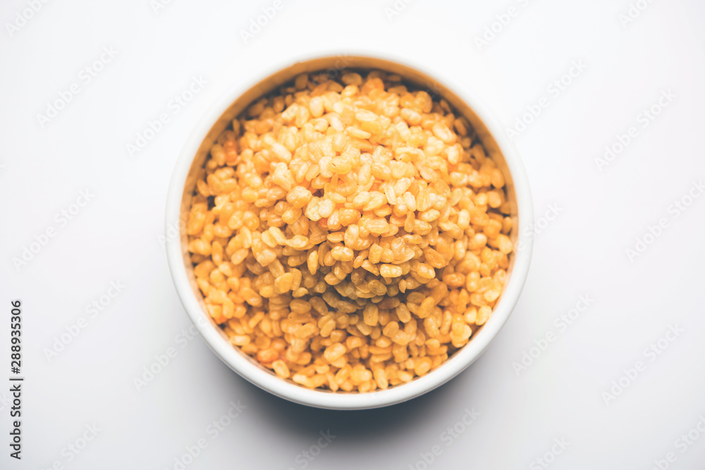Salty and Fried Moong Dal Namkeen served in a bowl, selective focus Salty and Fried Moong Dal Namkeen served in a bowl, selective focus
