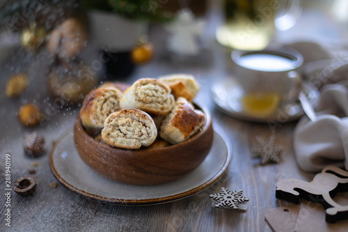 Oriental pastry made from puff pastry and wrapped in it a filling of sugar, butter and walnut. Armenian national pastry ghat or kyat with New Year's serving.. Selective focus