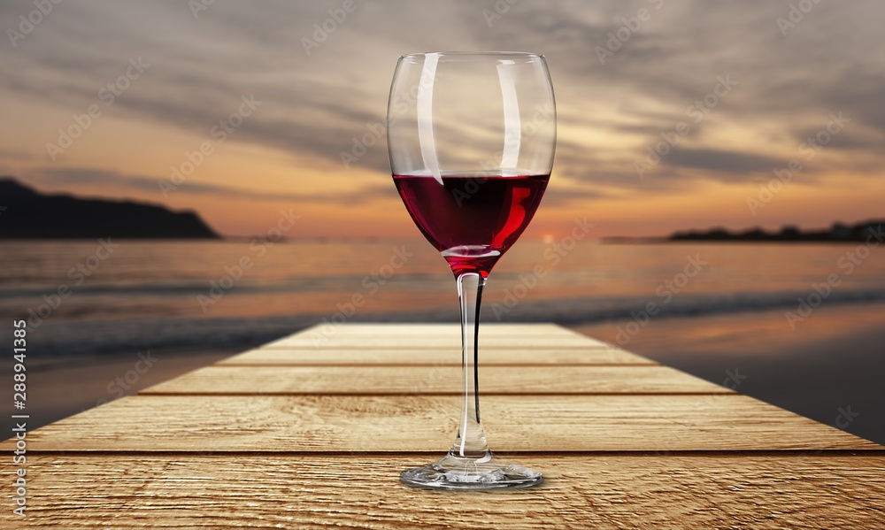 Red wine glass on wooden desk
