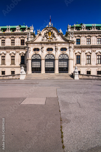 Beautiful view of Upper Belvedere Palace with statues. antique facade with carved elements, figures and bas-relief. Low angle view