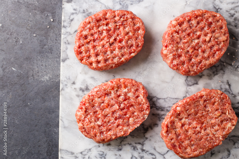 Raw burger cutlet from beef meat Raw burger cutlet from beef meat