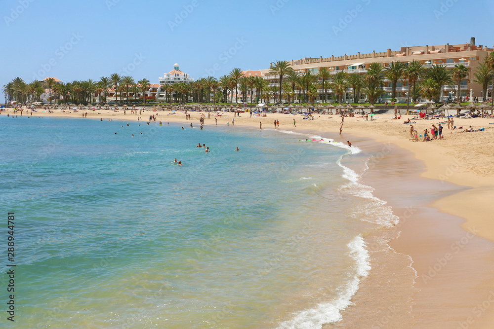 TENERIFE, SPAIN - MAY 28, 2019: Playa del Camison beach on Adeje Coast, Tenerife.