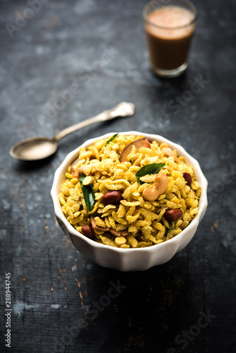 Jada Poha Namkeen Chivda / Thick Pohe Chiwda is a jar snack with a mix of sweet, salty and nuts flavours, served with tea. selective focus © Arundhati