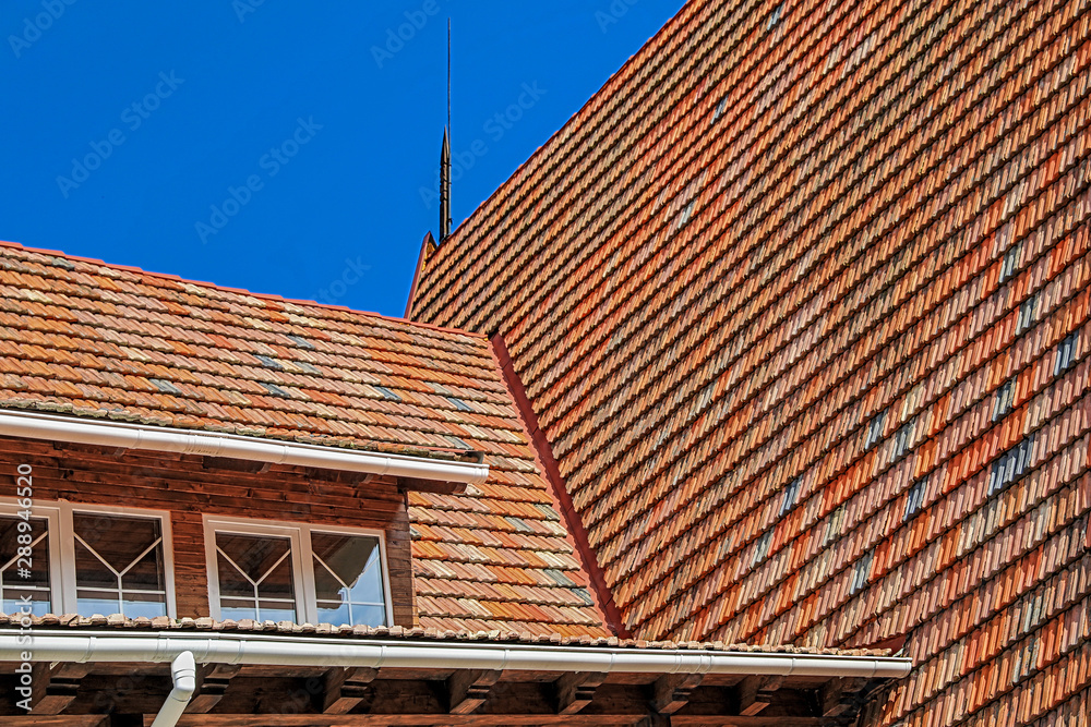 part of a steep gabled tiled roof