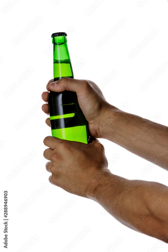male hand holding green beer bottle without label isolated on white background