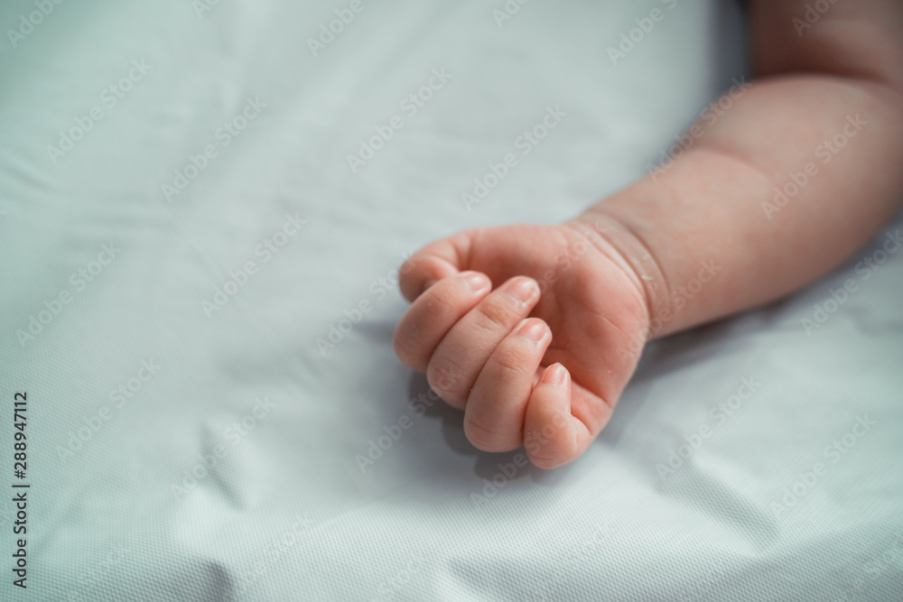 cropped image of little daughter hand when sleep on crib cropped image of little daughter hand when sleep on crib