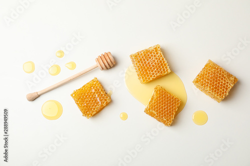 Honeycombs and dipper on white background, space for text