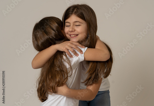 Konstfotografi Two beautiful sisters hugging each other in happy moments together