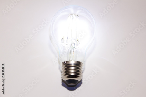 Filament lamps. Retro decorative glowing led light bulb on a white background