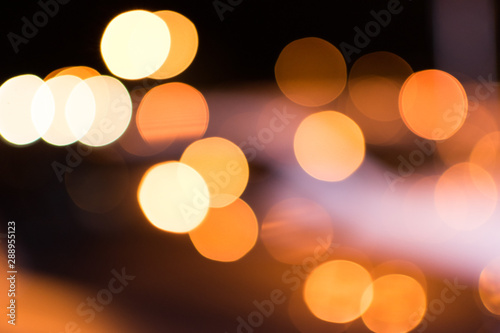 Blurred bokeh circles and colorful spots for abstract festive background.