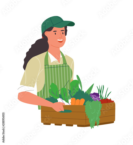 Happy farmer woman with organic vegetable box