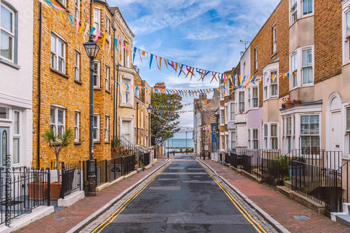 A view along Addington Street, Ramsgate toward the sea. Bunting is flying in preparation for the annual street fair. The street is part of Ramsgate's burgeoning music and art scene.