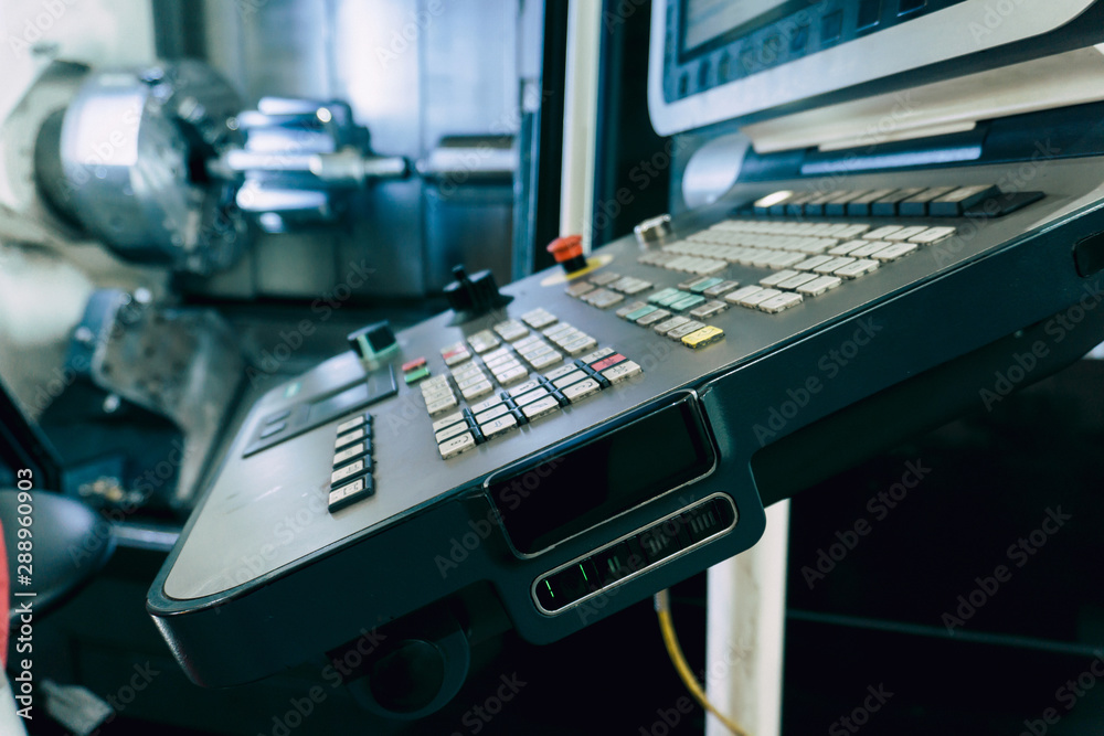 A machining center in the industry, manufacturing a gear shaft on a cnc machine.