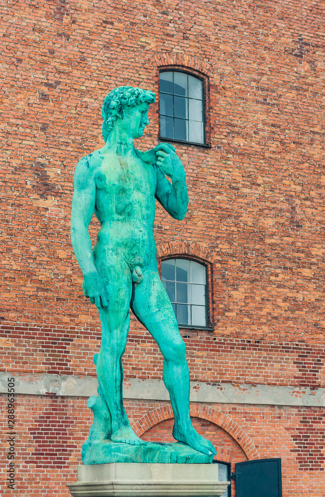 Naklejka premium Replica of Michelangelo's statue of David outside The Royal Cast Collection building on Langelinie Promenade. Copenhagen. Denmark