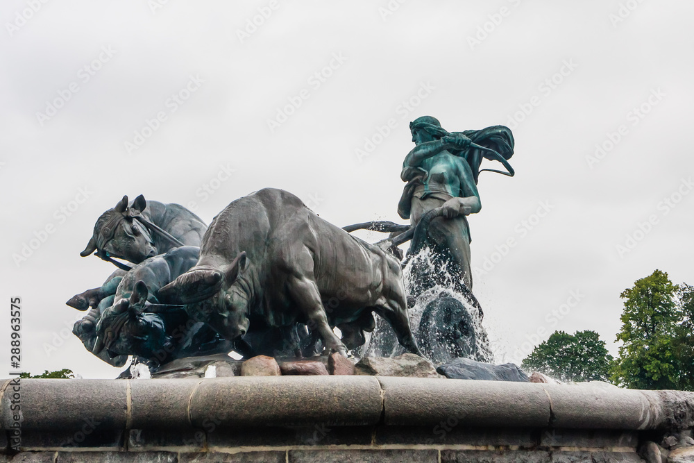 Norse goddess Gefjon statue by Anders Bundgaard on the Gefion Fountain. Churchill Park . Copenhagen. Denmark Norse goddess Gefjon statue by Anders Bundgaard on the Gefion Fountain. Churchill Park . Copenhagen. Denmark
