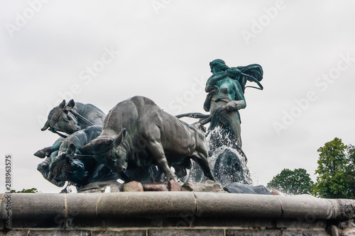 Norse goddess Gefjon statue by Anders Bundgaard on the Gefion Fountain. Churchill Park . Copenhagen. Denmark