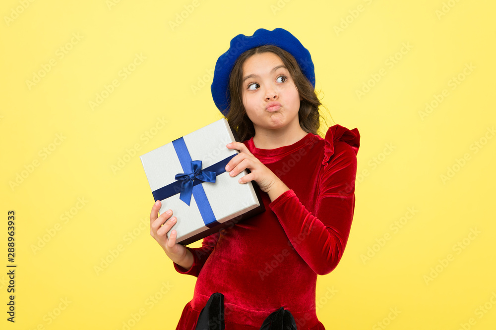Time to shop. thoughtful small girl with present box. small girl hold holiday gift. happy birthday. boxing day. parisian girl in french beret go shopping. autumn fashion. school fall season Time to shop. thoughtful small girl with present box. small girl hold holiday gift. happy birthday. boxing day. parisian girl in french beret go shopping. autumn fashion. school fall season