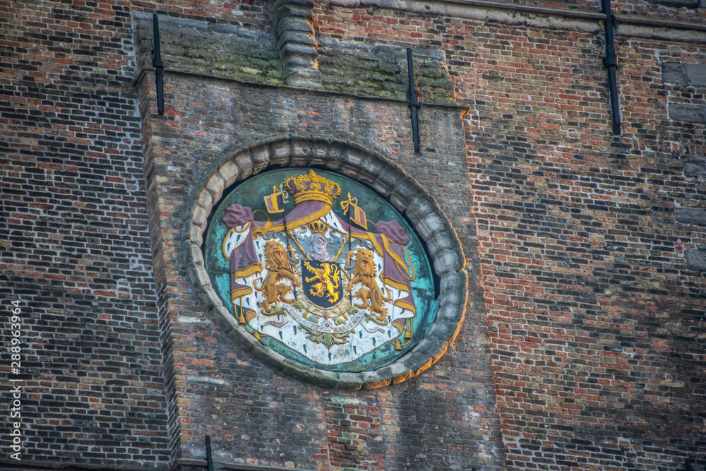Crest in a brick wall
