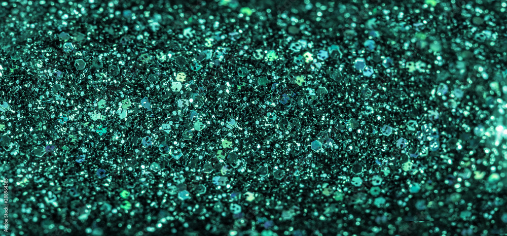 Mint colored holiday glitter background. Blurred festive green backdrop for your design. Holiday concept Mint colored holiday glitter background. Blurred festive green backdrop for your design. Holiday concept
