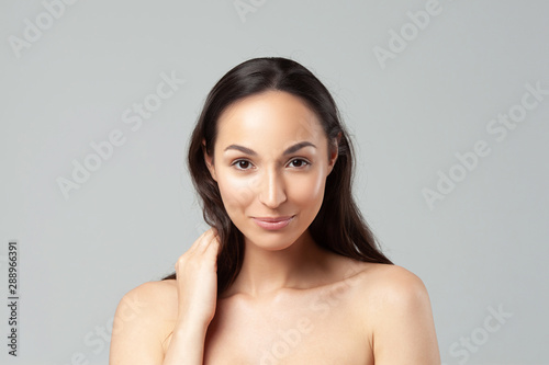 Young beautiful woman with clean perfect skin close-up.