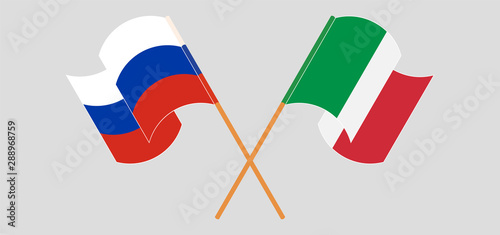 Crossed and waving flags of Russia and Italy