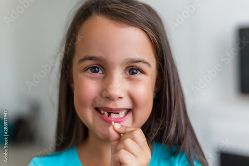 Little girl first tooth missing