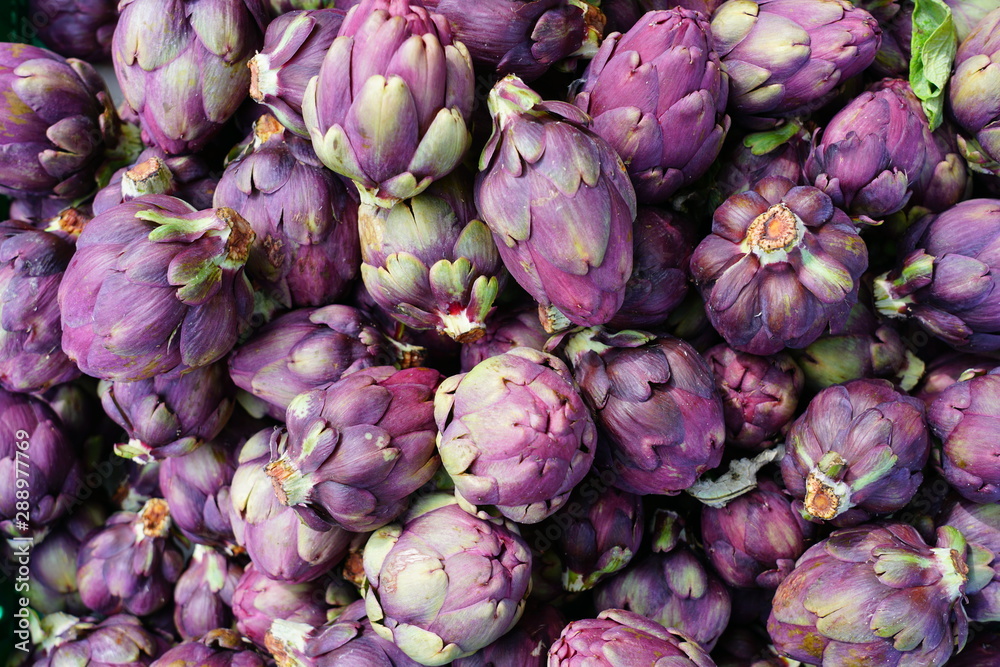 Crate of purple artichokes at a farmers market in Geneva, Switzerland Crate of purple artichokes at a farmers market in Geneva, Switzerland