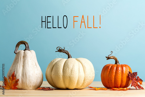 Hello fall message with pumpkins on a blue background photo