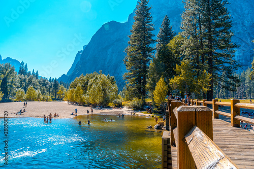 Yosemite National Park, California / United States »; August 2019: A young man throwing himself headlong into the water at Swinging Bridge, Yosemite valley photo