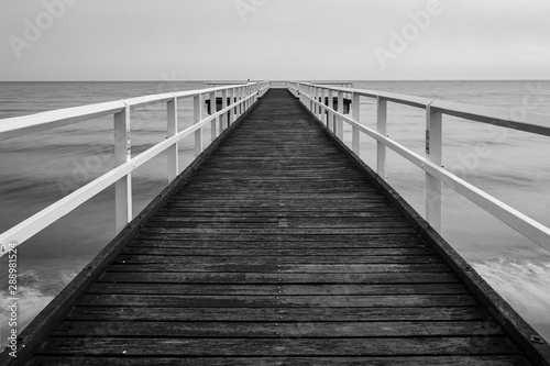 Wooden sea pier black and white