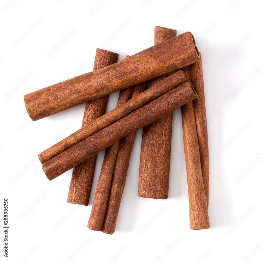 Cinnamon sticks isolated on white background closeup. Canella spice. Aromatic condiment background. Flat lay, top view.