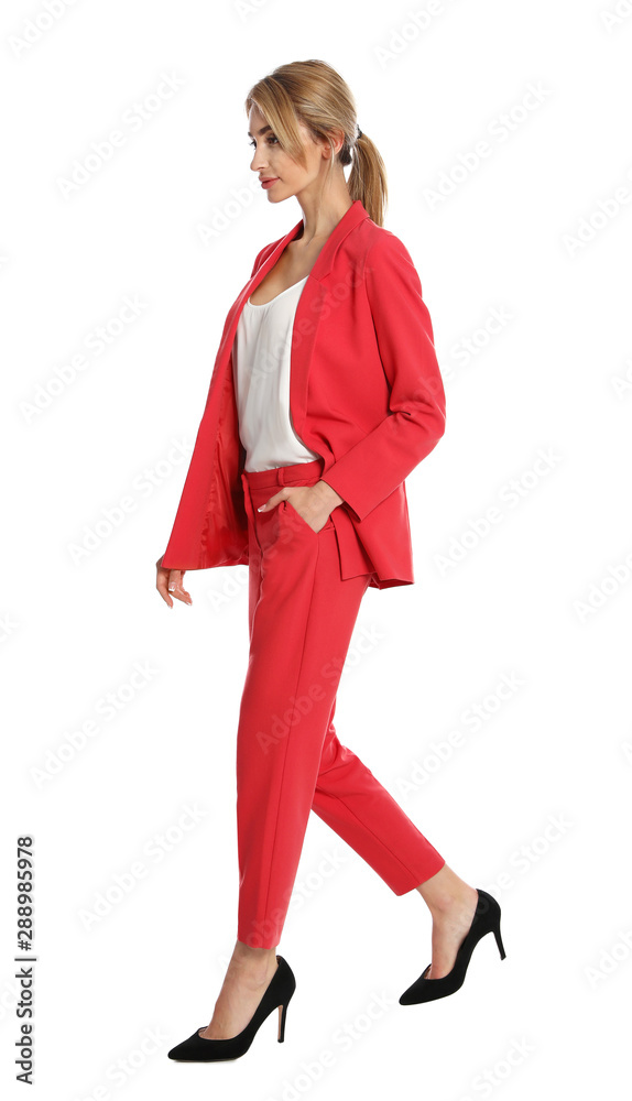 Beautiful young woman in red suit posing on white background Beautiful young woman in red suit posing on white background