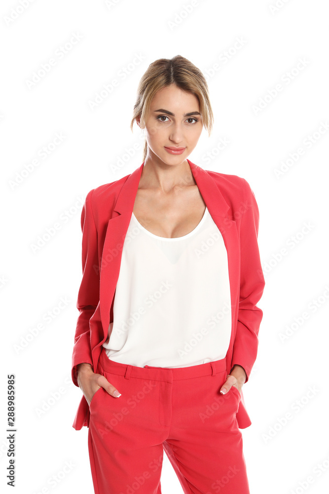Fototapeta premium Beautiful young woman in red suit posing on white background