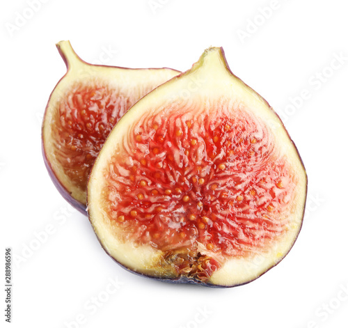 Halves of fresh fig fruit on white background