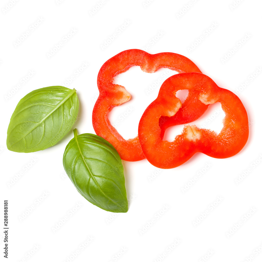 red pepper slices with basil leaves isolated on white background cutout. Top view, flat lay. red pepper slices with basil leaves isolated on white background cutout. Top view, flat lay.