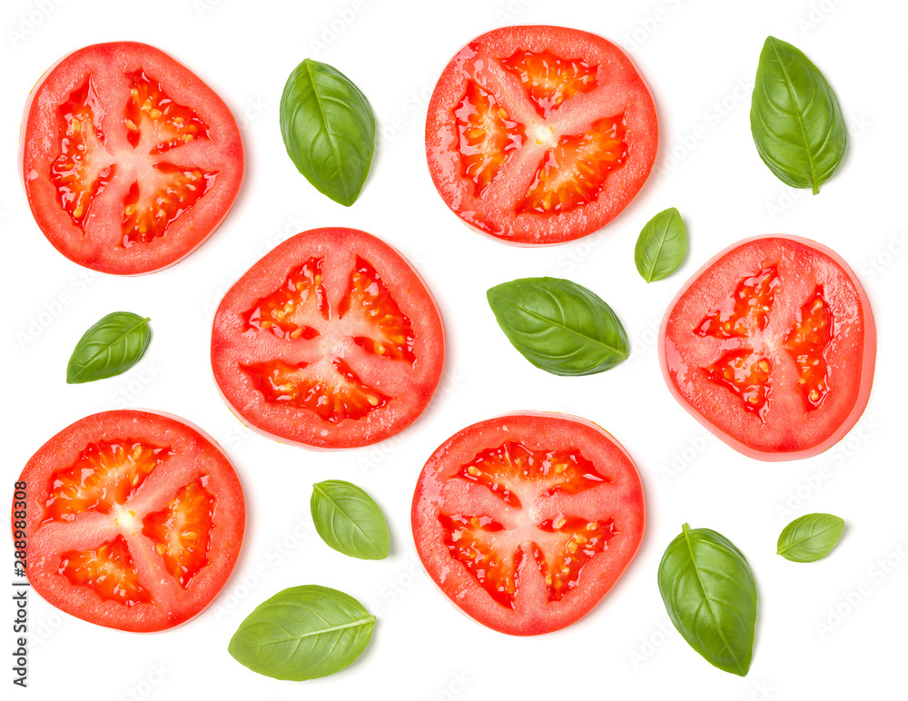 Creative layout made of tomato slices and basil leaves. Flat lay, top view. Vegetables isolated on white background. Food ingredient pattern. Creative layout made of tomato slices and basil leaves. Flat lay, top view. Vegetables isolated on white background. Food ingredient pattern.