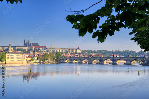 A view across the Charles Bridge and the Vltava River to Prague Castle and St. Vitas Cathedral in Prague, Czech Republic. photo