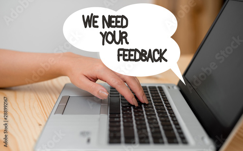 Writing note showing We Need Your Feedback. Business concept for criticism given to say can be done improvement woman with laptop smartphone and office supplies technology