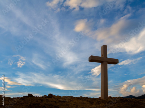 Silhouette cross on mountain at sunset background.Crucifixion Of Jesus Christ