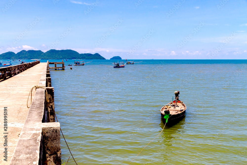 Beach fishing boat and bridge at Baan Koh Teap b
