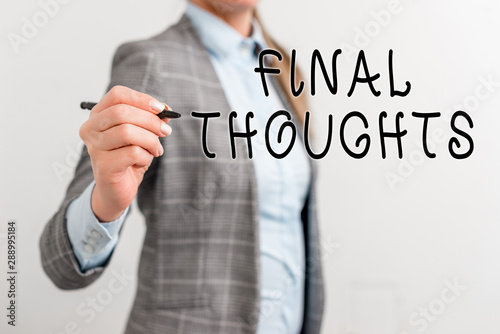 Writing note showing Final Thoughts. Business concept for the conclusion or last few sentences within your conclusion Business woman pointing in empty space with pen photo