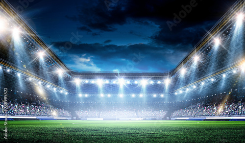 Fototapeta Naklejka Na Ścianę i Meble -  Full night football arena in lights