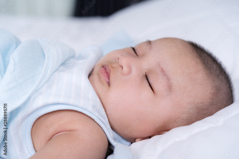 baby sleeping on a bed at home baby sleeping on a bed at home