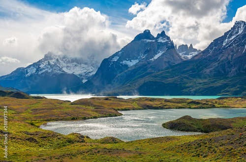The colorful Nordenskjold and Pehoe Lake during summer in windy Patagonia with a dramatic sky  Torres del Paine national park  Puerto Natales  Chile.