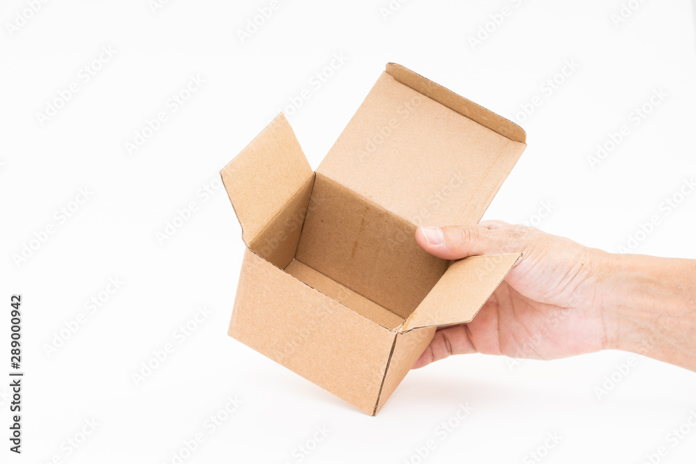 Man hand holding brown paper box on white background Man hand holding brown paper box on white background