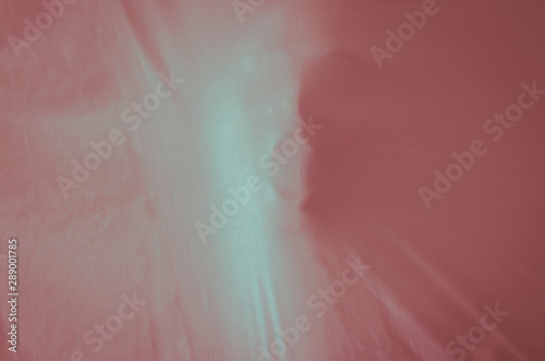Scary ghost face behind red cloth sheet background for Halloween Festival concept.